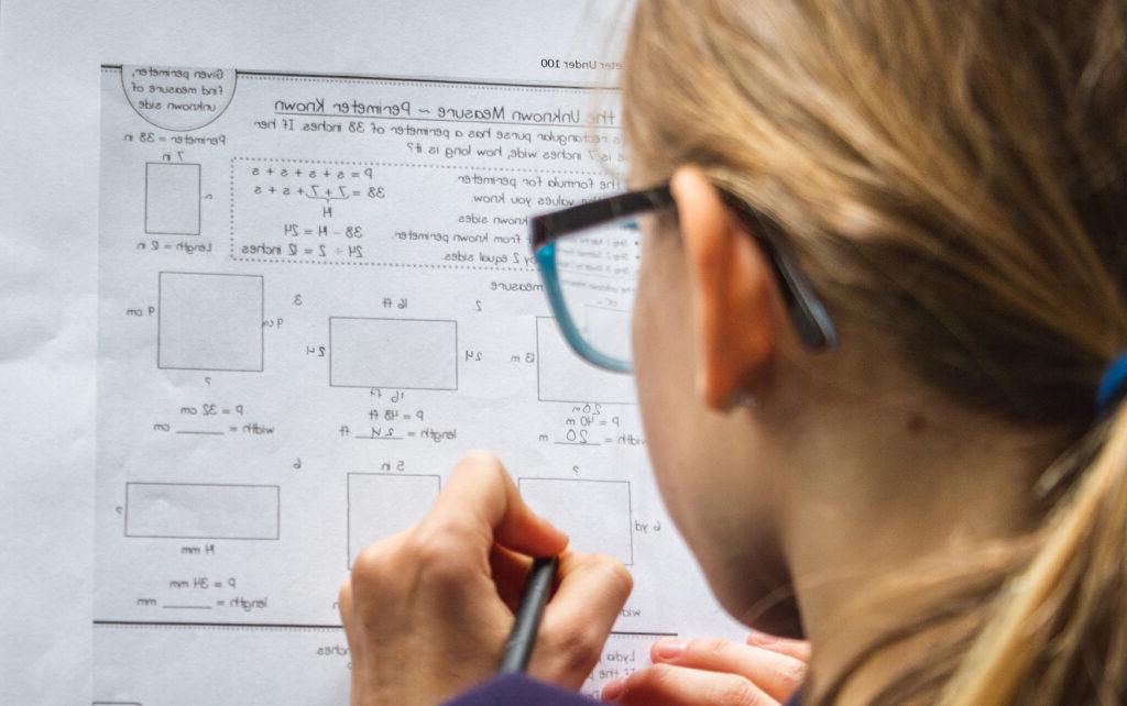 Mid-level math student solving equations